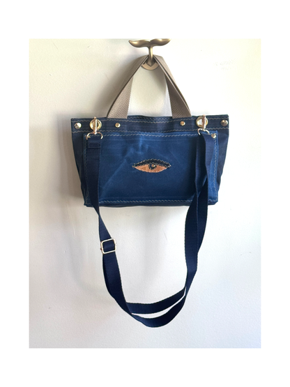 Surrealist Face Bag on Waxed Cotton