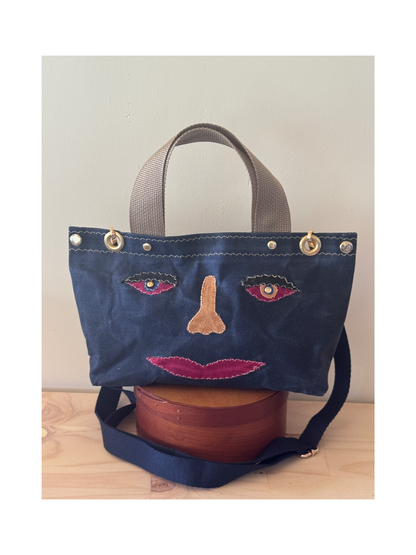 Surrealist Face Bag on Waxed Cotton